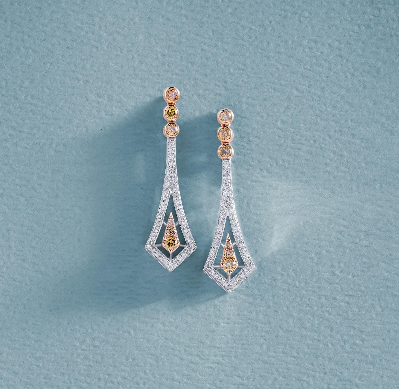 earrings with diamonds on blue surface
