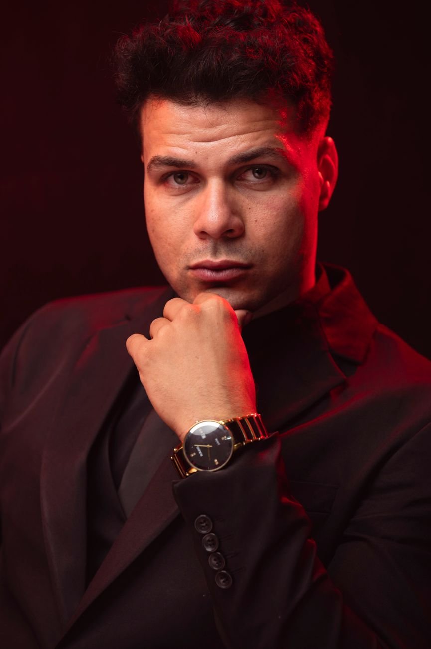confident man in suit with dramatic lighting