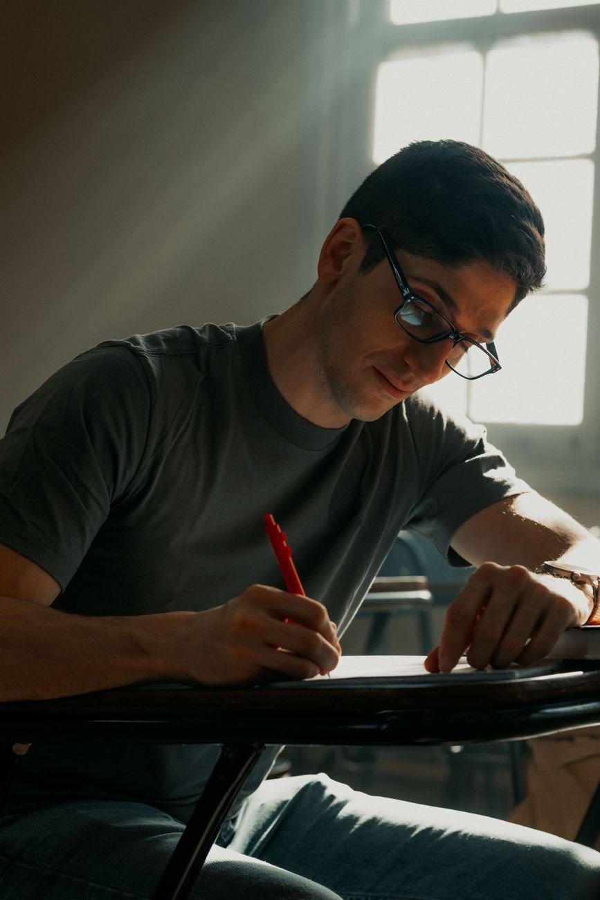 focused student studying in sunlit room